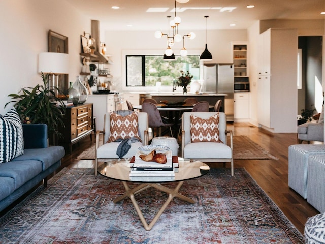 living area with recessed lighting and wood finished floors