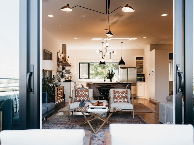living area featuring recessed lighting and wood finished floors