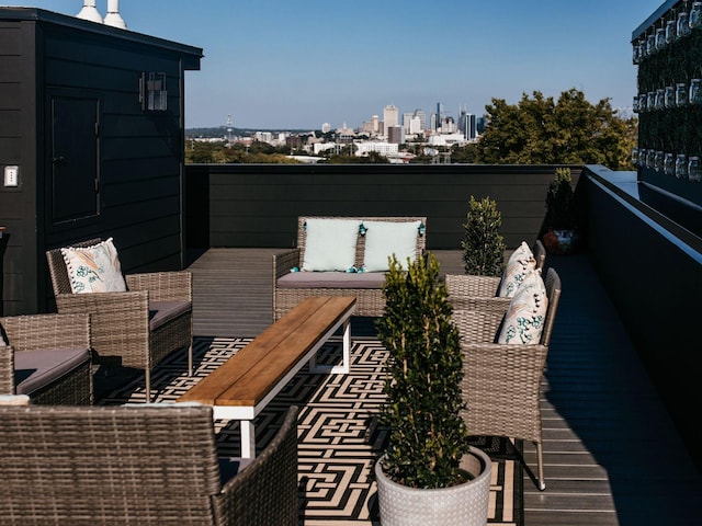 exterior space featuring a view of city and an outdoor living space