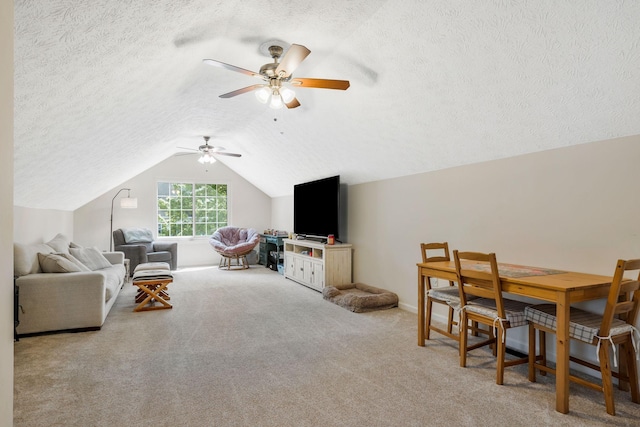 1077 Meandering Way, Franklin, TN 37067 - carpeted living area featuring a textured ceiling, vaulted ceiling, and ceiling fan