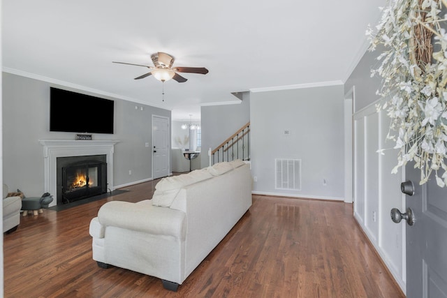 1077 Meandering Way, Franklin, TN 37067 - living room featuring visible vents, ceiling fan, dark wood-style floors, stairway, and a fireplace with flush hearth