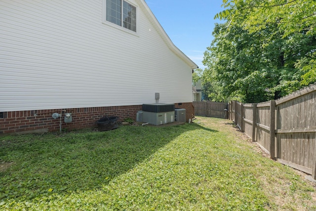 1077 Meandering Way, Franklin, TN 37067 - view of side of home featuring a fenced backyard, a yard, crawl space, and central AC unit