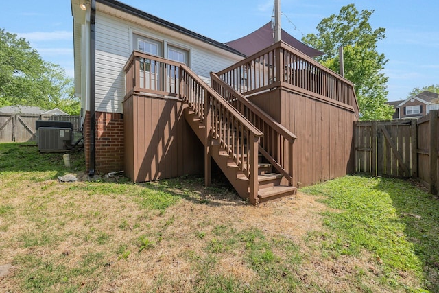 1077 Meandering Way, Franklin, TN 37067 - back of property featuring central AC, a deck, stairway, a fenced backyard, and a yard