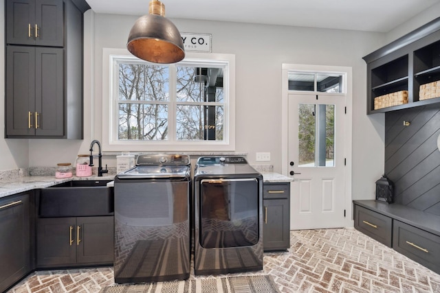 741 Saundersville Ferry Rd, Mount Juliet, TN 37122 - washroom with a sink, cabinet space, brick floor, and independent washer and dryer