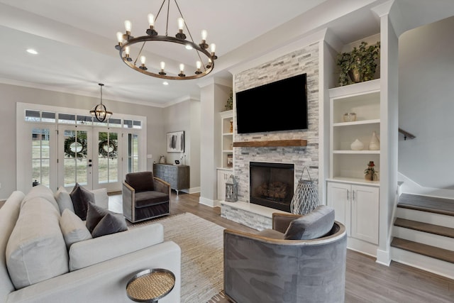 741 Saundersville Ferry Rd, Mount Juliet, TN 37122 - living room featuring crown molding, a notable chandelier, french doors, wood finished floors, and stairway