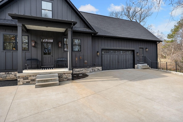 741 Saundersville Ferry Rd, Mount Juliet, TN 37122 - doorway to property with board and batten siding, concrete driveway, roof with shingles, and a garage