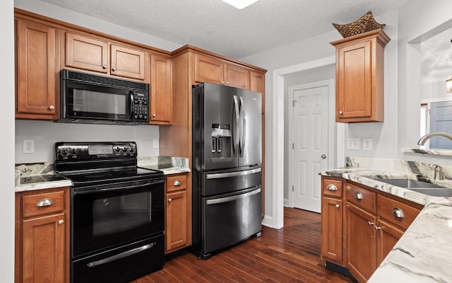 433 Stanford Dr, Flintstone, GA 30725 - kitchen with a sink, brown cabinets, black appliances, and dark wood finished floors