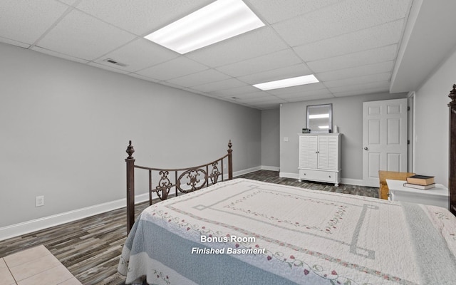 433 Stanford Dr, Flintstone, GA 30725 - bedroom with visible vents, baseboards, a drop ceiling, and wood finished floors