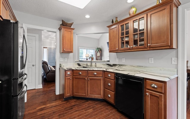 433 Stanford Dr, Flintstone, GA 30725 - kitchen with dark wood-type flooring, black dishwasher, brown cabinets, and fridge with ice dispenser