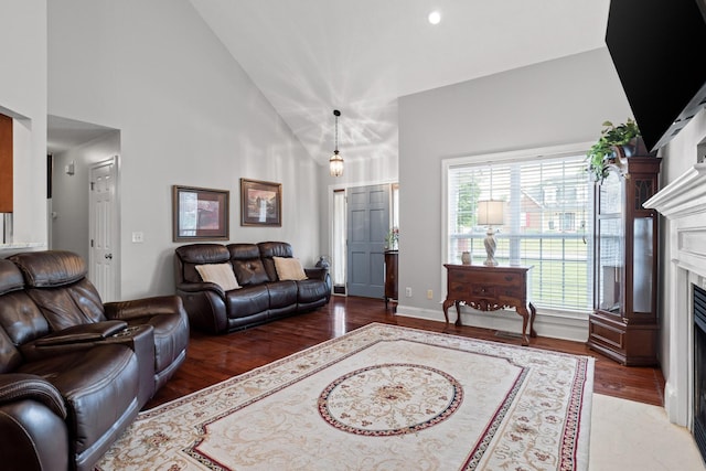 433 Stanford Dr, Flintstone, GA 30725 - living area featuring high vaulted ceiling, a fireplace with flush hearth, and wood finished floors