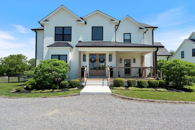 7314 Dug Hill Rd, Bon Aqua, TN 37025 - view of front of home featuring a porch, a standing seam roof, a metal roof, and brick siding