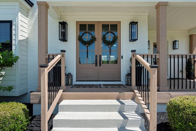 7314 Dug Hill Rd, Bon Aqua, TN 37025 - view of exterior entry with french doors and a porch