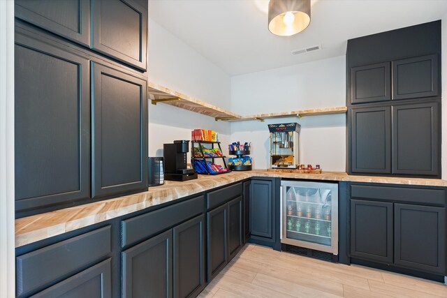 7314 Dug Hill Rd, Bon Aqua, TN 37025 - indoor dry bar with wine cooler and light wood finished floors