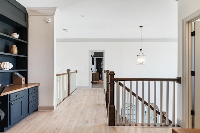7314 Dug Hill Rd, Bon Aqua, TN 37025 - corridor with an upstairs landing, crown molding, light wood finished floors, and built in features