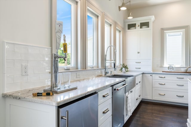 7314 Dug Hill Rd, Bon Aqua, TN 37025 - kitchen featuring white cabinets, stainless steel dishwasher, light stone counters, pendant lighting, and glass insert cabinets
