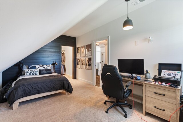 7314 Dug Hill Rd, Bon Aqua, TN 37025 - bedroom with a desk, lofted ceiling, wood walls, and light carpet