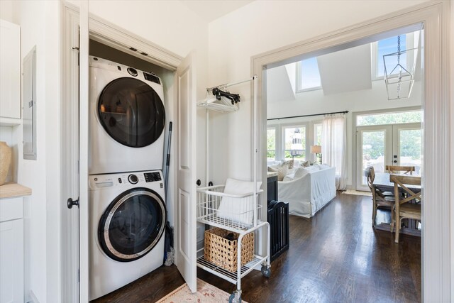 7314 Dug Hill Rd, Bon Aqua, TN 37025 - washroom with stacked washer / drying machine, french doors, a skylight, dark wood finished floors, and electric panel