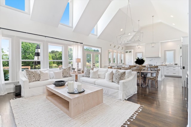 7314 Dug Hill Rd, Bon Aqua, TN 37025 - living area with high vaulted ceiling, dark wood-type flooring, healthy amount of natural light, and french doors