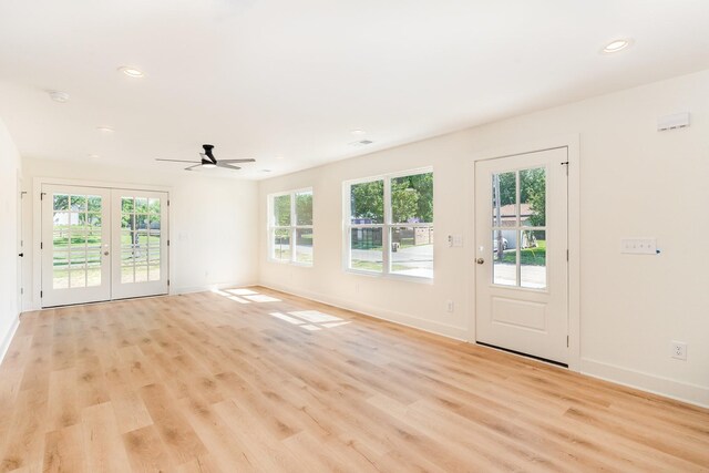 interior space with baseboards and light wood-type flooring