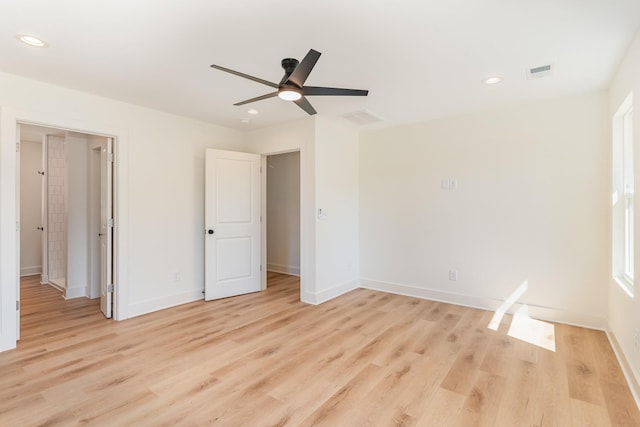 unfurnished bedroom with visible vents, recessed lighting, light wood finished floors, and baseboards