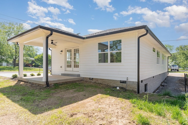 back of property with french doors, ceiling fan, and crawl space
