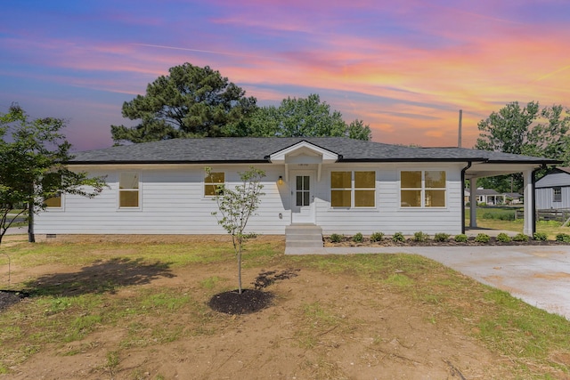 view of front of property with roof with shingles and a front lawn