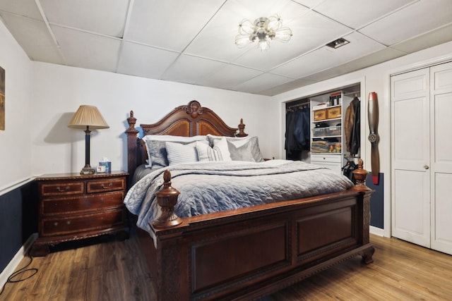 223 Kennett Rd, Old Hickory, TN 37138 - bedroom featuring baseboards, a paneled ceiling, wood finished floors, and visible vents