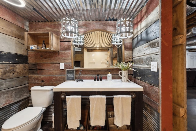 223 Kennett Rd, Old Hickory, TN 37138 - bathroom with vanity, toilet, wood walls, a chandelier, and visible vents