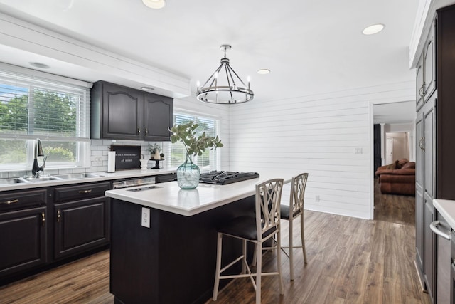223 Kennett Rd, Old Hickory, TN 37138 - kitchen featuring a notable chandelier, a sink, light countertops, a kitchen breakfast bar, and a kitchen island