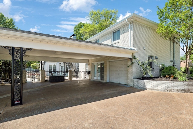 223 Kennett Rd, Old Hickory, TN 37138 - exterior space featuring brick siding, a garage, french doors, and driveway