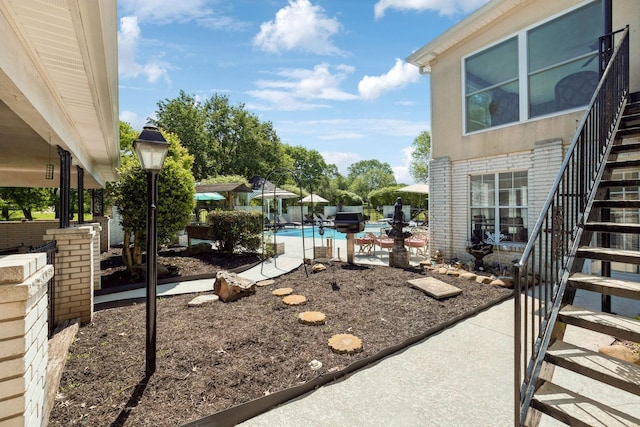 223 Kennett Rd, Old Hickory, TN 37138 - view of yard featuring a fenced in pool, fence, stairs, and a patio