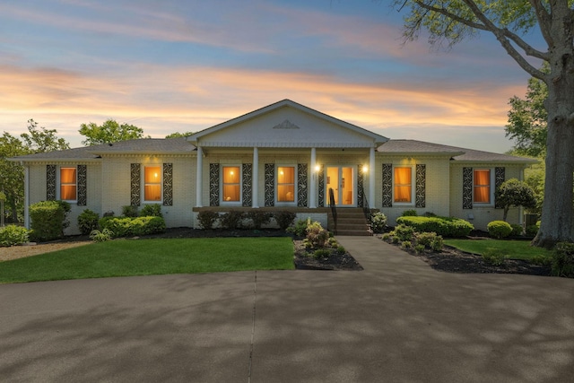 223 Kennett Rd, Old Hickory, TN 37138 - view of front of property featuring a porch, a front lawn, and brick siding