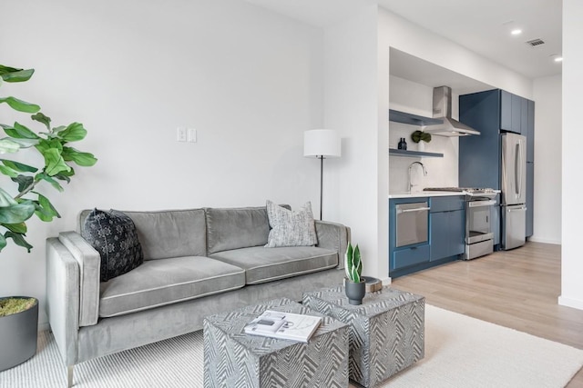 500 Merritt Ave Unit S2 C, Nashville, TN 37203 - living room featuring recessed lighting, baseboards, visible vents, and light wood-type flooring