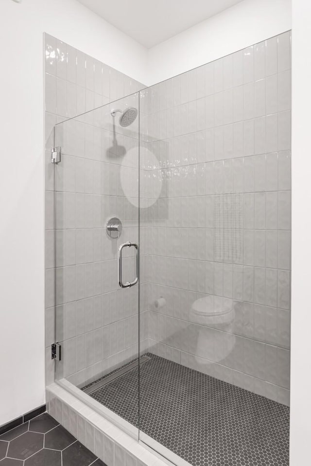 500 Merritt Ave Unit S2 C, Nashville, TN 37203 - bathroom with tile patterned floors, a stall shower, and toilet