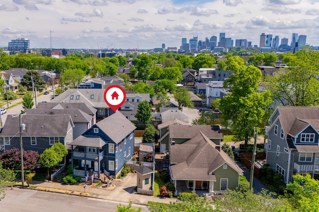 birds eye view of property with a residential view