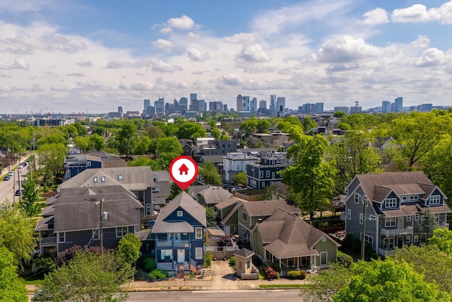 birds eye view of property with a view of city