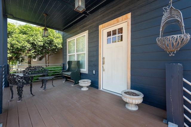 wooden terrace featuring covered porch