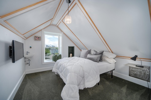 bedroom with carpet floors, baseboards, and lofted ceiling