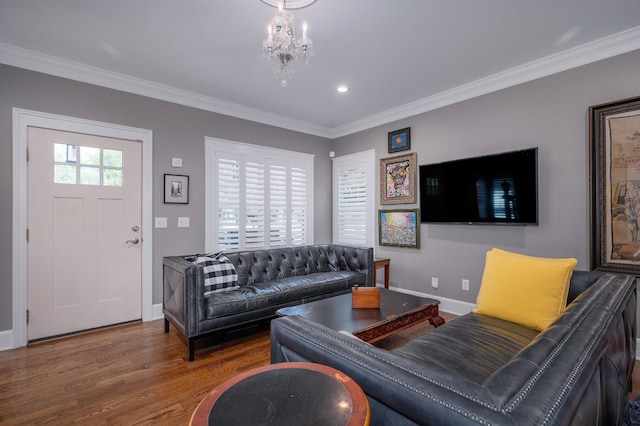 living room featuring baseboards, ornamental molding, and wood finished floors