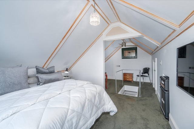 carpeted bedroom with lofted ceiling