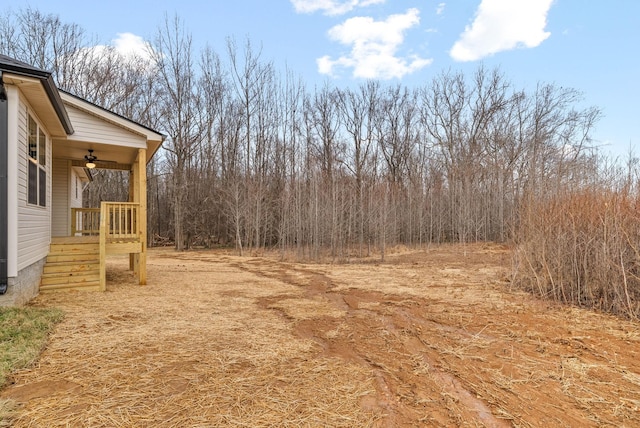 view of yard with a ceiling fan