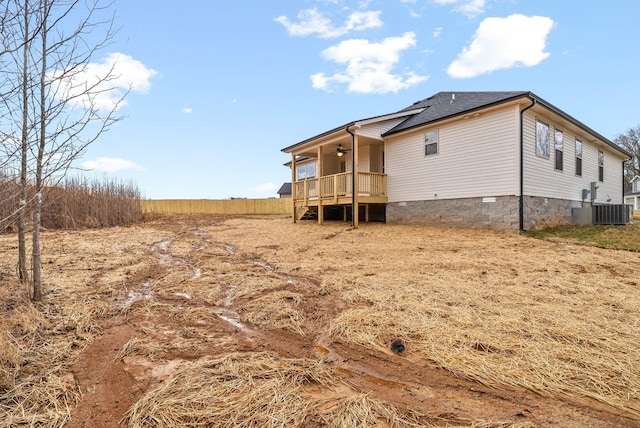 back of house featuring ceiling fan, central air condition unit, and crawl space