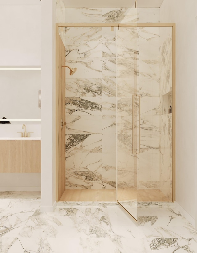 full bath featuring a sink, a marble finish shower, and marble finish floor