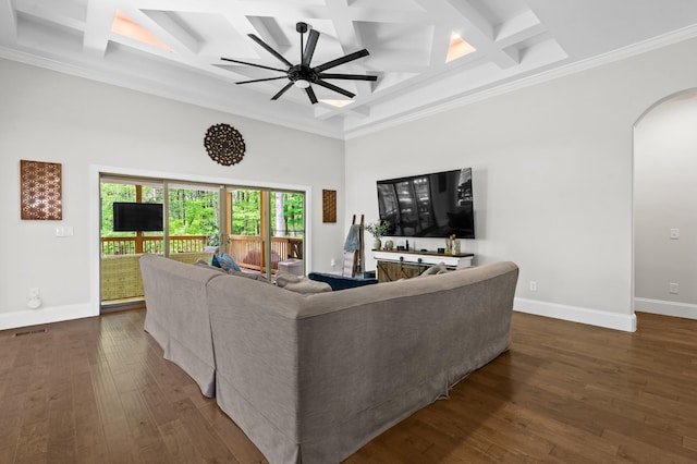 living area with arched walkways, baseboards, dark wood finished floors, and coffered ceiling