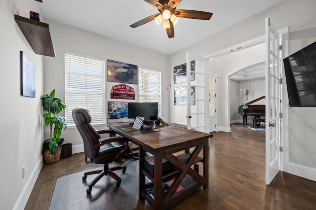 office space with arched walkways, baseboards, french doors, and wood finished floors