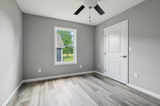 605 Poplar St, Lafayette, TN 37083 - unfurnished room with light wood-style floors, baseboards, a ceiling fan, and visible vents