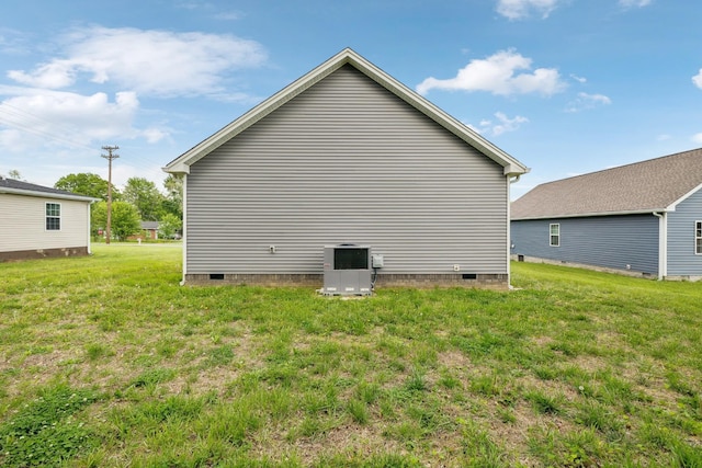 605 Poplar St, Lafayette, TN 37083 - view of side of home with central AC, a yard, and crawl space