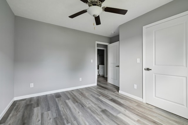 605 Poplar St, Lafayette, TN 37083 - unfurnished bedroom featuring baseboards, ceiling fan, and wood finished floors