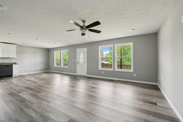 605 Poplar St, Lafayette, TN 37083 - unfurnished living room featuring a textured ceiling, ceiling fan, and wood finished floors