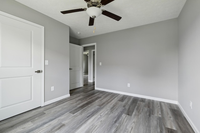 605 Poplar St, Lafayette, TN 37083 - unfurnished bedroom featuring baseboards, ceiling fan, and wood finished floors